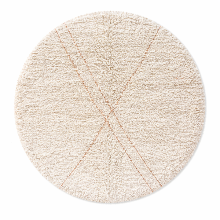 Round handmade Moroccan wool shag rug in cream with subtle Beni Ourain cross pattern on white background