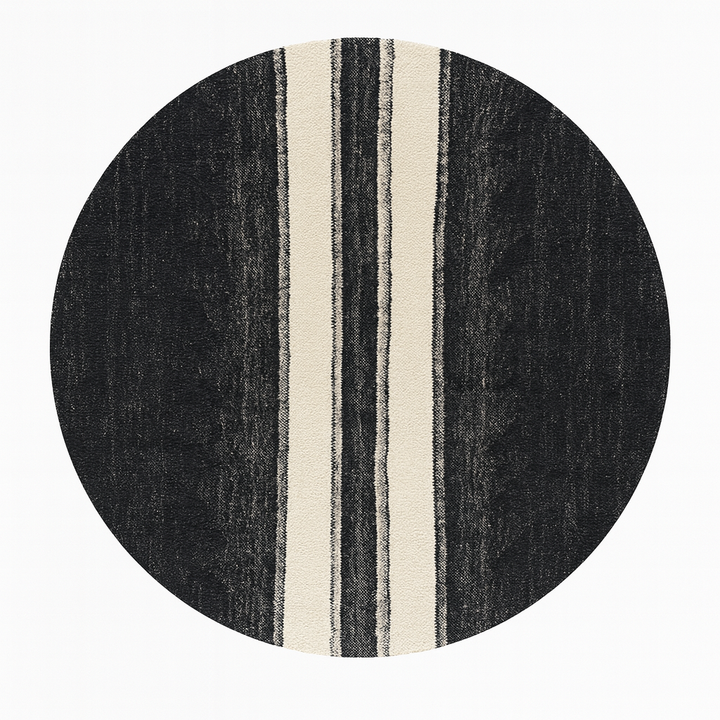 Round black and white flat-woven Moroccan rug.