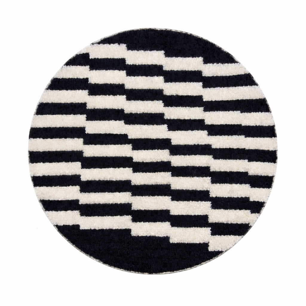Round black and white Moroccan wool rug with handmade Berber geometric pattern on a clean white background