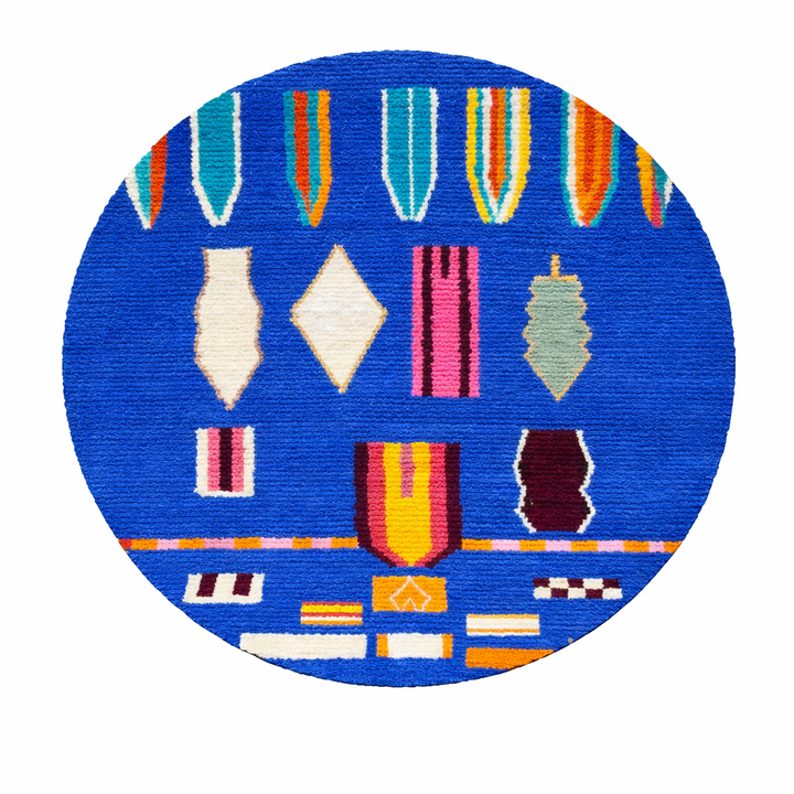 Round blue Moroccan Berber wool rug with colorful geometric patterns on a white background