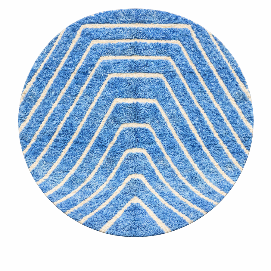 Round blue Moroccan wool rug with carved Berber line pattern and sculpted texture