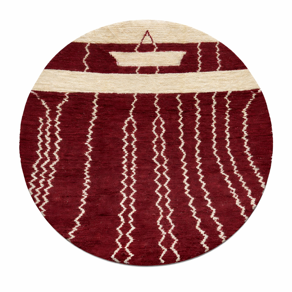 Handmade round Moroccan wool rug in rich burgundy red with ivory Berber geometric patterns, artisan-crafted Amazigh round area rug.