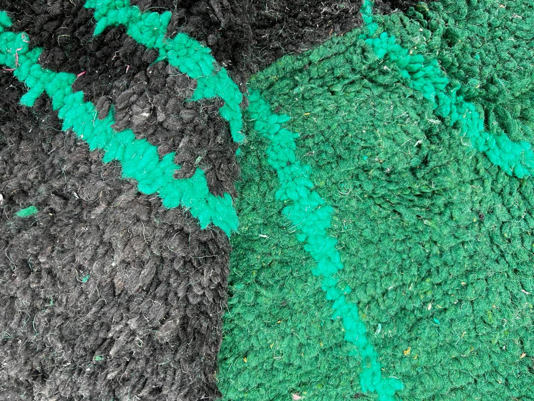 Round green Moroccan wool rug with modern Berber line patterns