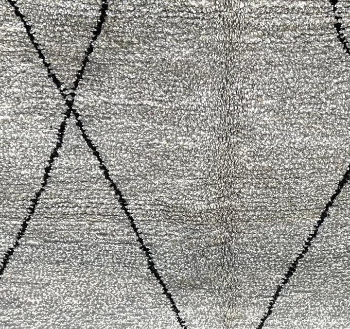 Round grey Moroccan wool rug with minimalist black diamond Beni Ourain lines handmade by Berber artisans