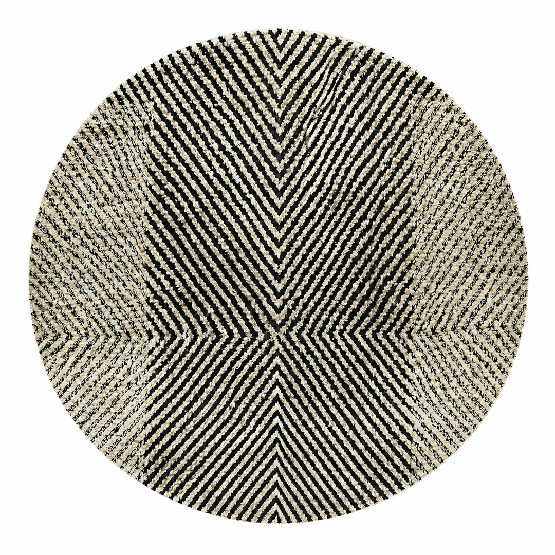 Handmade round Moroccan Berber rug in black and white with symmetrical tribal design