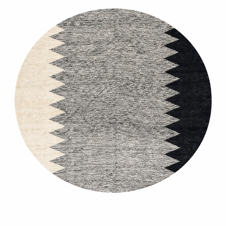 Handmade round Moroccan kilim rug with flatweave construction, featuring a black, and white zigzag geometric pattern.