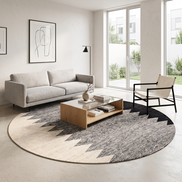 Handmade round Moroccan kilim rug with flatweave construction, featuring a black, and white zigzag geometric pattern.