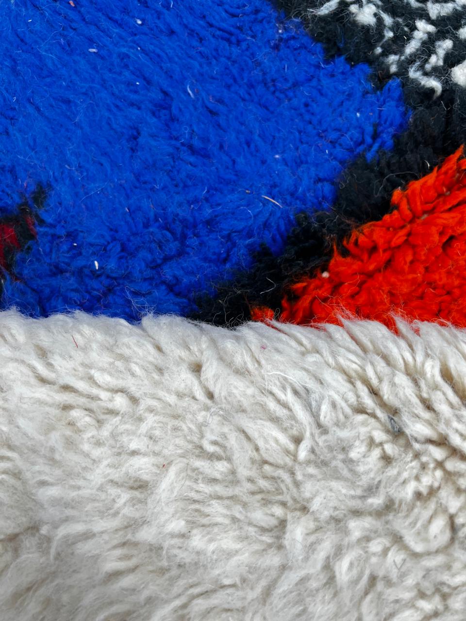 Colorful round Moroccan rug with symbolic Berber design