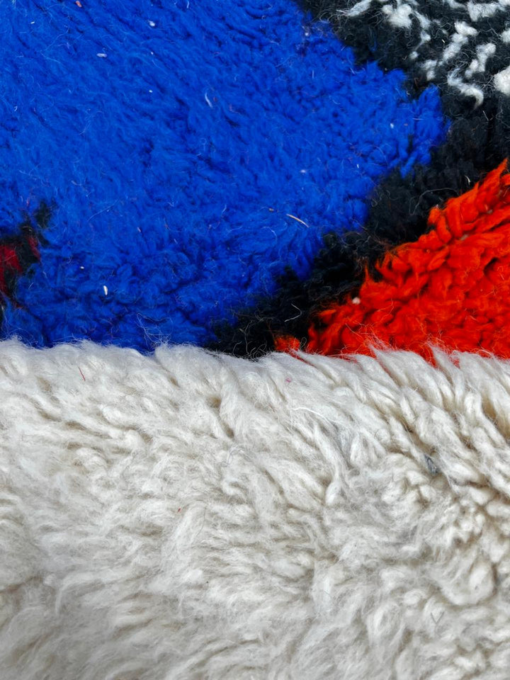 Colorful round Moroccan rug with symbolic Berber design