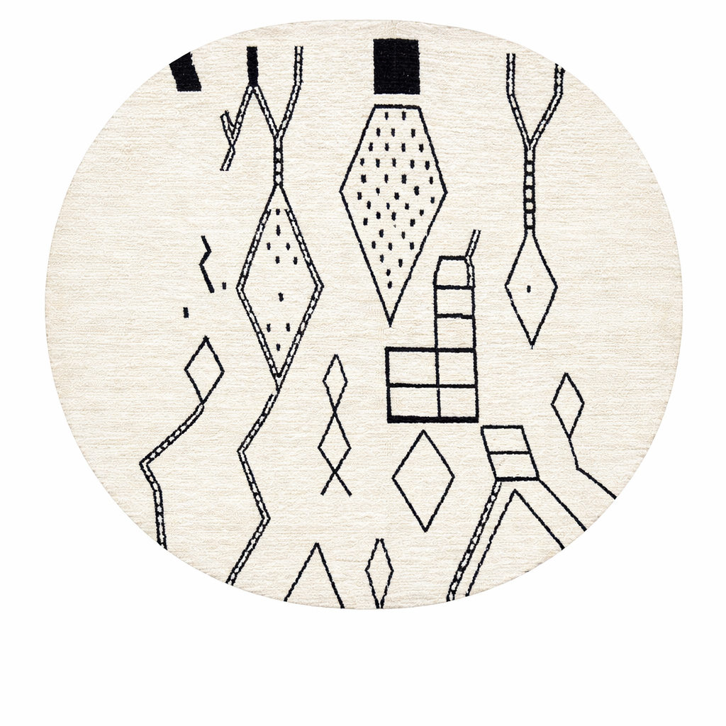 Handmade round Moroccan wool rug with traditional Berber symbols, featuring black geometric motifs on an white wool base.