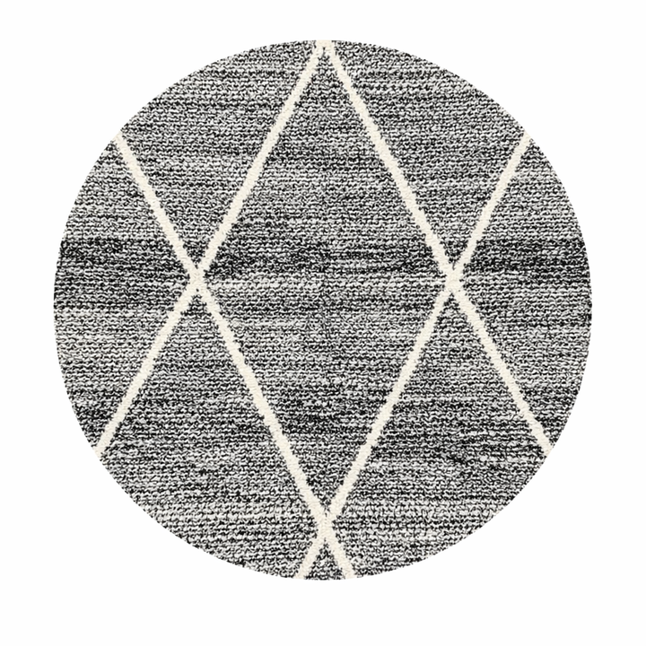 Round black and white Moroccan wool rug with geometric Berber diamond pattern on white background