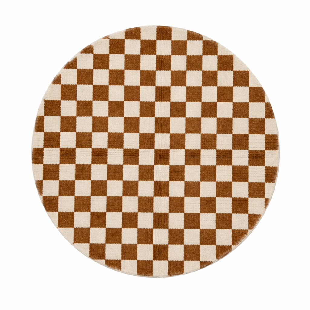 Round Moroccan wool rug with brown and white checkerboard pattern on a white background