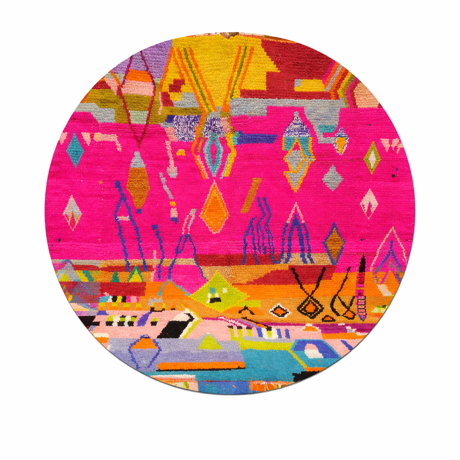 Round Moroccan wool rug with colorful abstract Berber design on pink background
