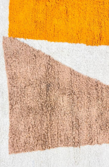 Round Moroccan wool rug with modern abstract Berber design in earth tones