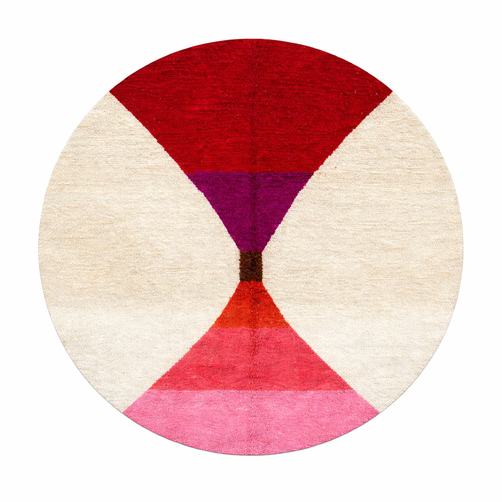 Handmade round Moroccan wool rug with modern geometric design, featuring cream base and bold red, burgundy, purple, orange, and pink color blocks.