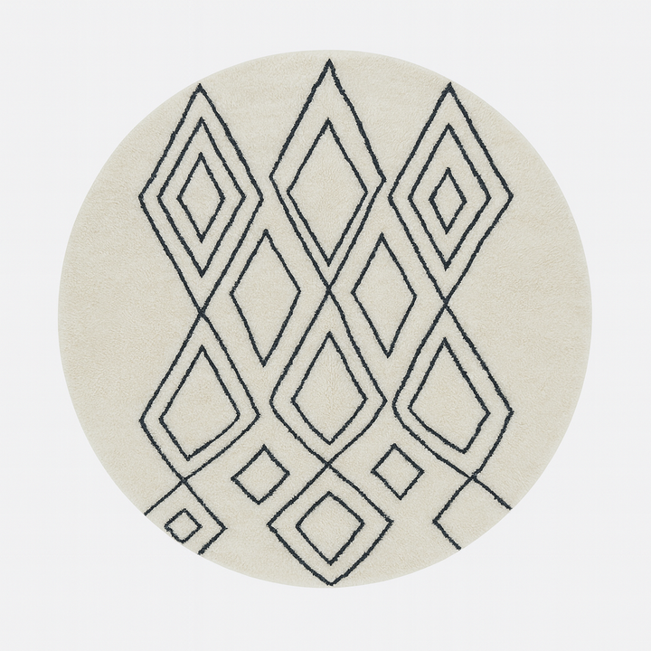 Round Moroccan wool rug in white with black Berber diamond pattern, handmade by artisans