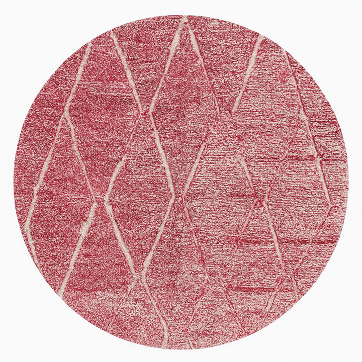 Round pink Moroccan wool rug with white Beni Ourain diamond pattern, handmade by Berber artisans