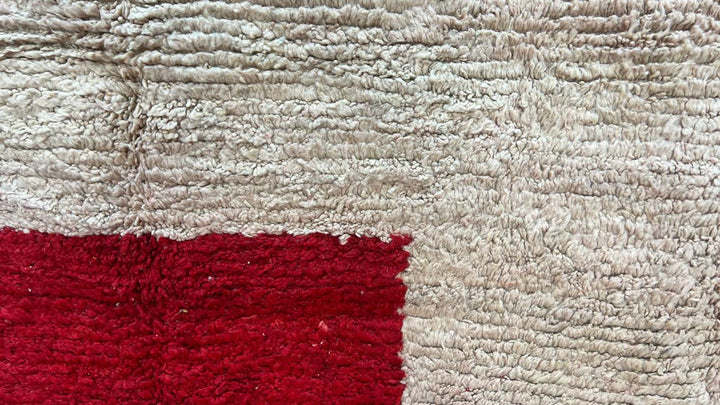 Handmade round Moroccan wool rug in red and beige color-block design