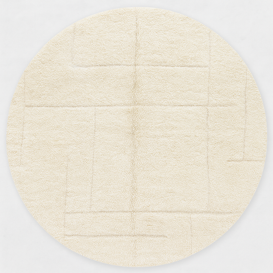Round white Moroccan wool rug with subtle carved geometric line pattern