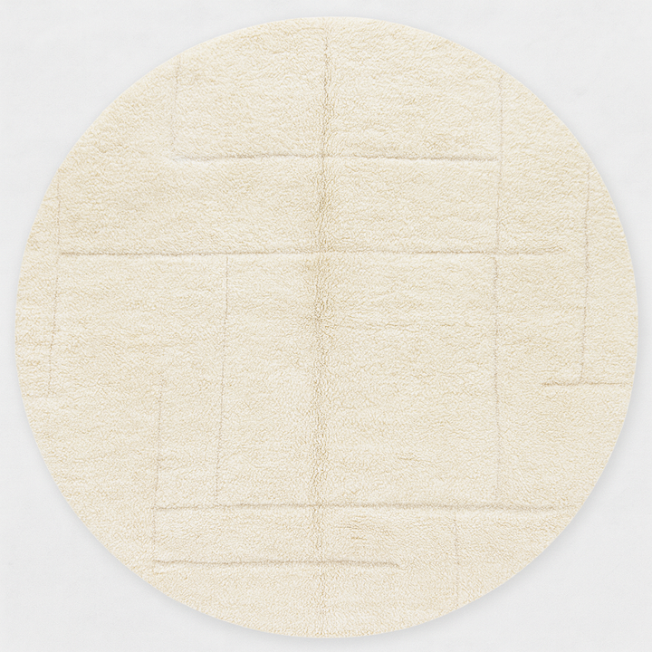 Round white Moroccan wool rug with subtle carved geometric line pattern