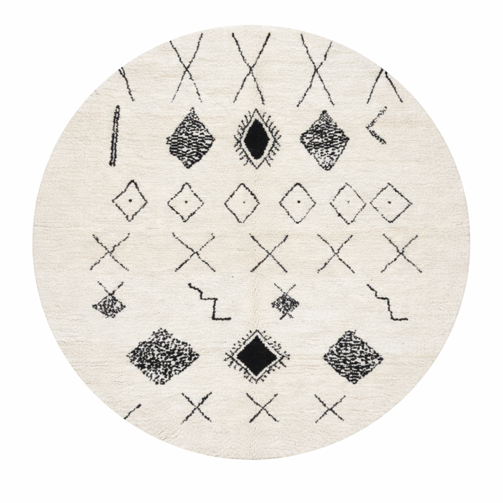 Round white Moroccan wool rug with black Berber symbols and geometric patterns on white background