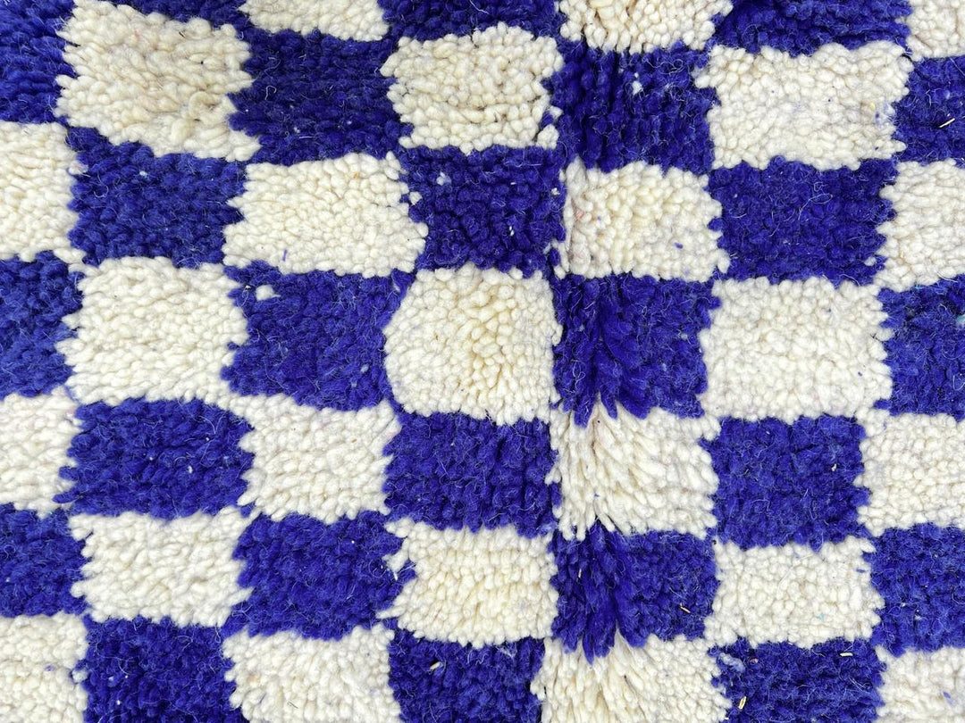 Round blue and white Moroccan checkered rug