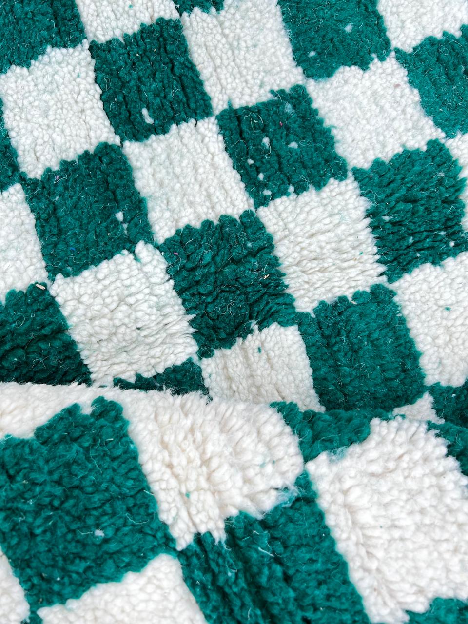Round green and white checkered Moroccan wool rug, handmade.