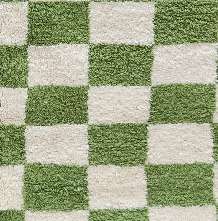 Round Moroccan wool rug with green and white checkered pattern, handmade plush checkerboard carpet