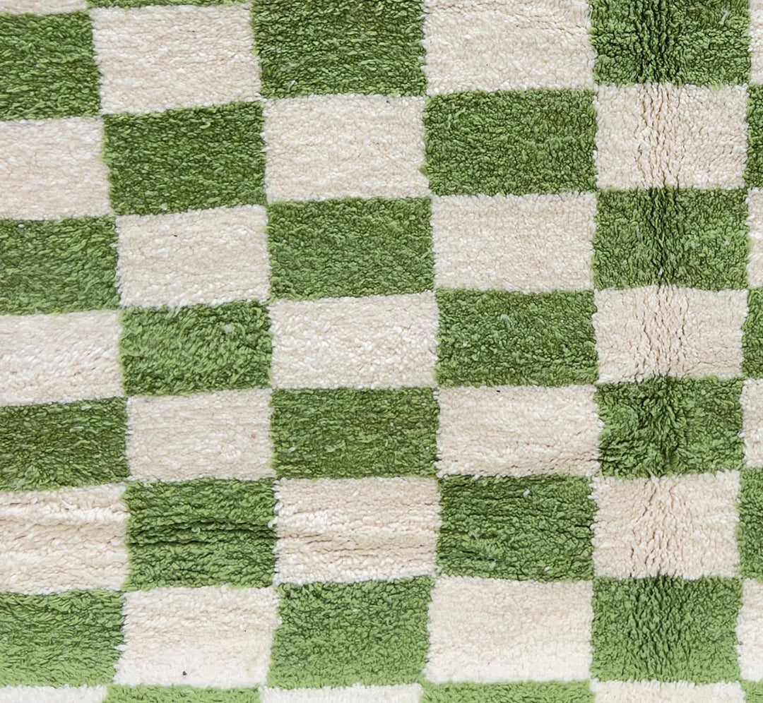 Round Moroccan wool rug with green and white checkered pattern, handmade plush checkerboard carpet