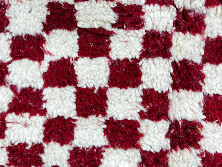 Round red and white checkered Moroccan wool rug