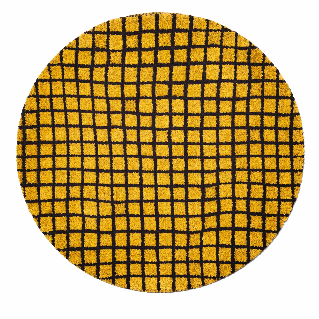 Round handmade Moroccan wool rug in mustard yellow with bold black grid pattern on white background