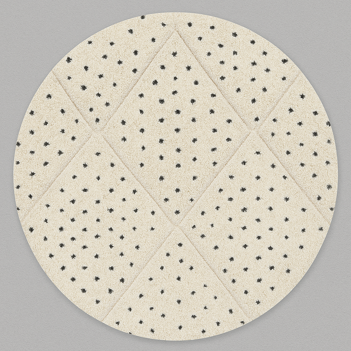 Round white Moroccan wool rug with black dotted motifs and carved diamond pattern
