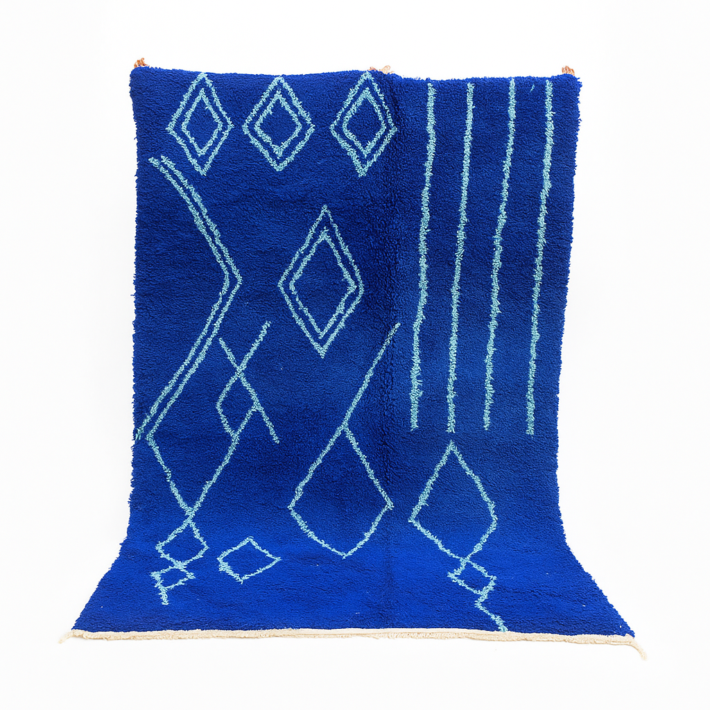 Handwoven royal-blue Moroccan wool rug with geometric light-blue diamond and line patterns
