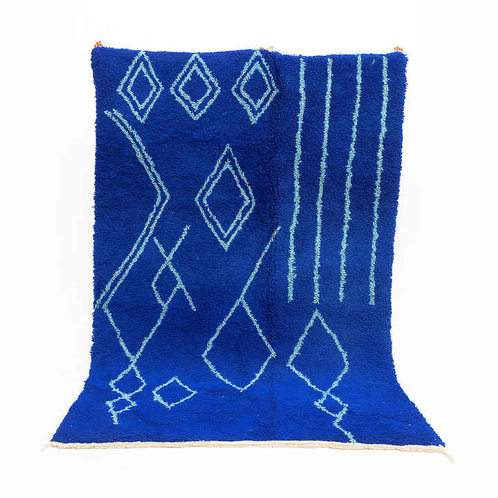 Handwoven royal-blue Moroccan wool rug with geometric light-blue diamond and line patterns