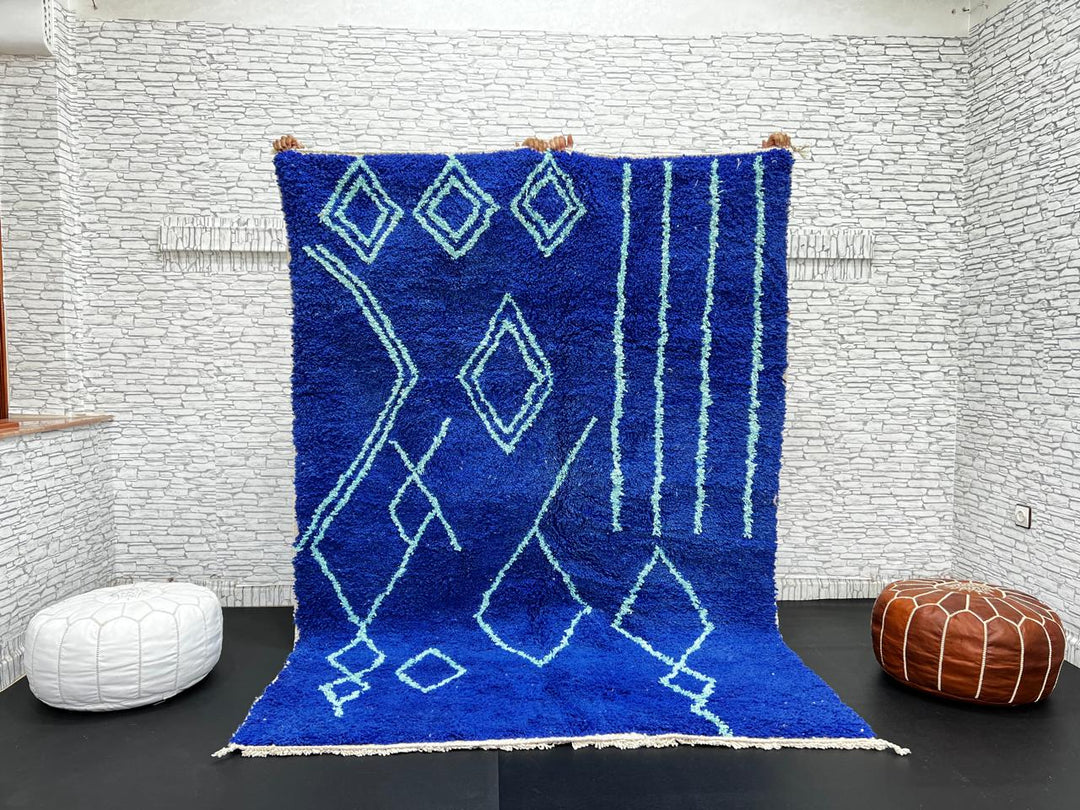 Handwoven royal-blue Moroccan wool rug with geometric light-blue diamond and line patterns