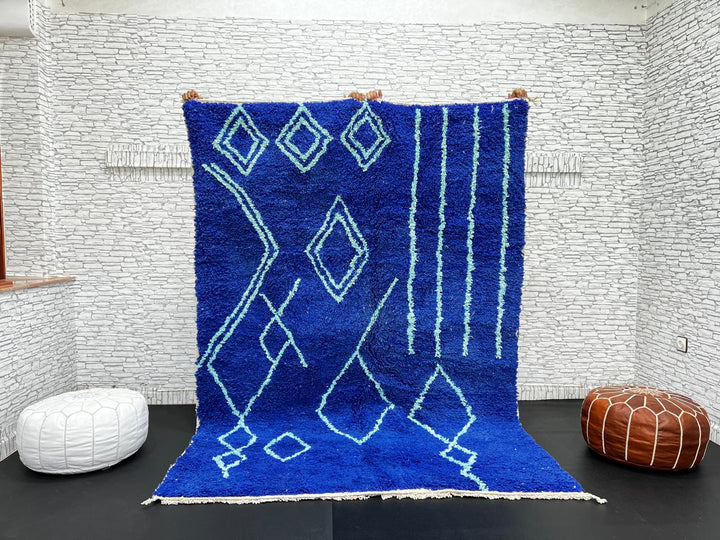 Handwoven royal-blue Moroccan wool rug with geometric light-blue diamond and line patterns