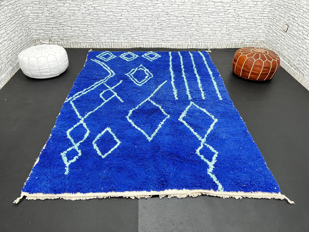 Handwoven royal-blue Moroccan wool rug with geometric light-blue diamond and line patterns