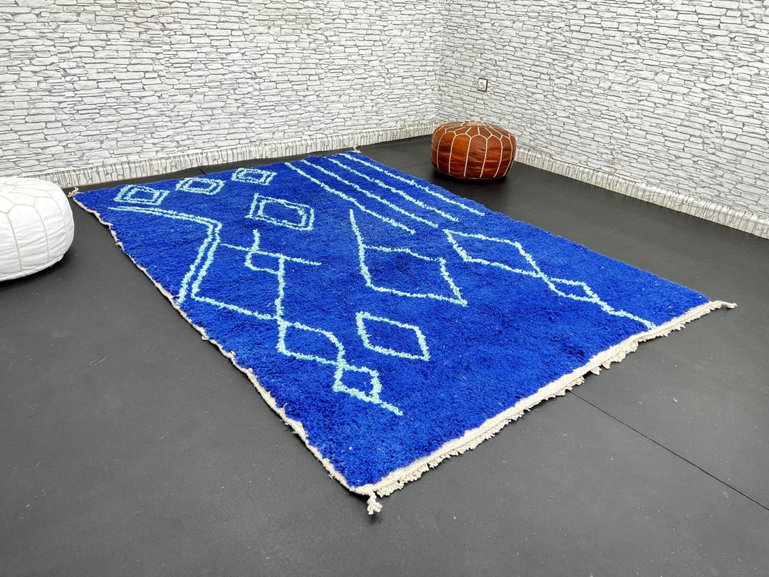 Handwoven royal-blue Moroccan wool rug with geometric light-blue diamond and line patterns