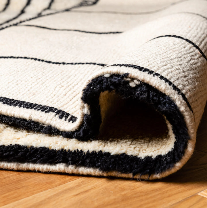 Striped Moroccan Wool Rug – Modern Black Lines on Ivory Base