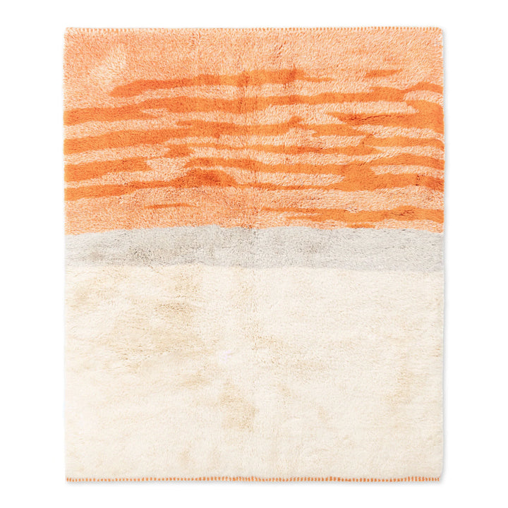 Sunrise Beni Mrirt Moroccan wool rug with warm orange and terracotta tones, handmade, inspired by desert dawn hues.