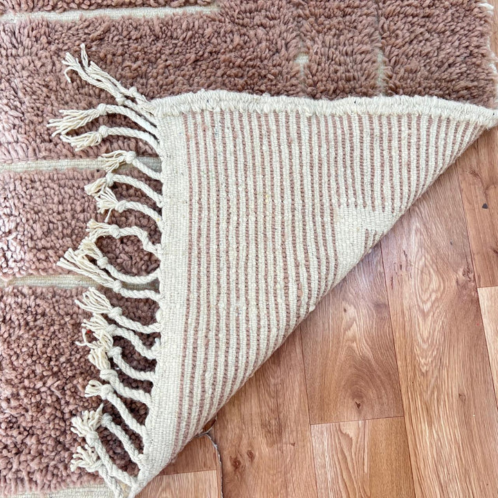 terracotta moroccan wool rug with sculpted carved line design