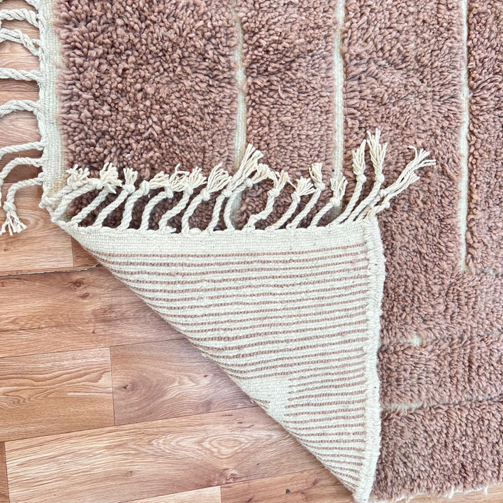 terracotta moroccan wool rug with sculpted carved line design