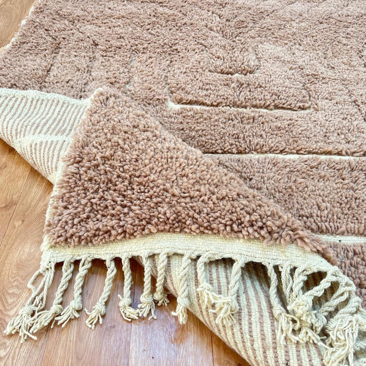 terracotta moroccan wool rug with sculpted carved line design