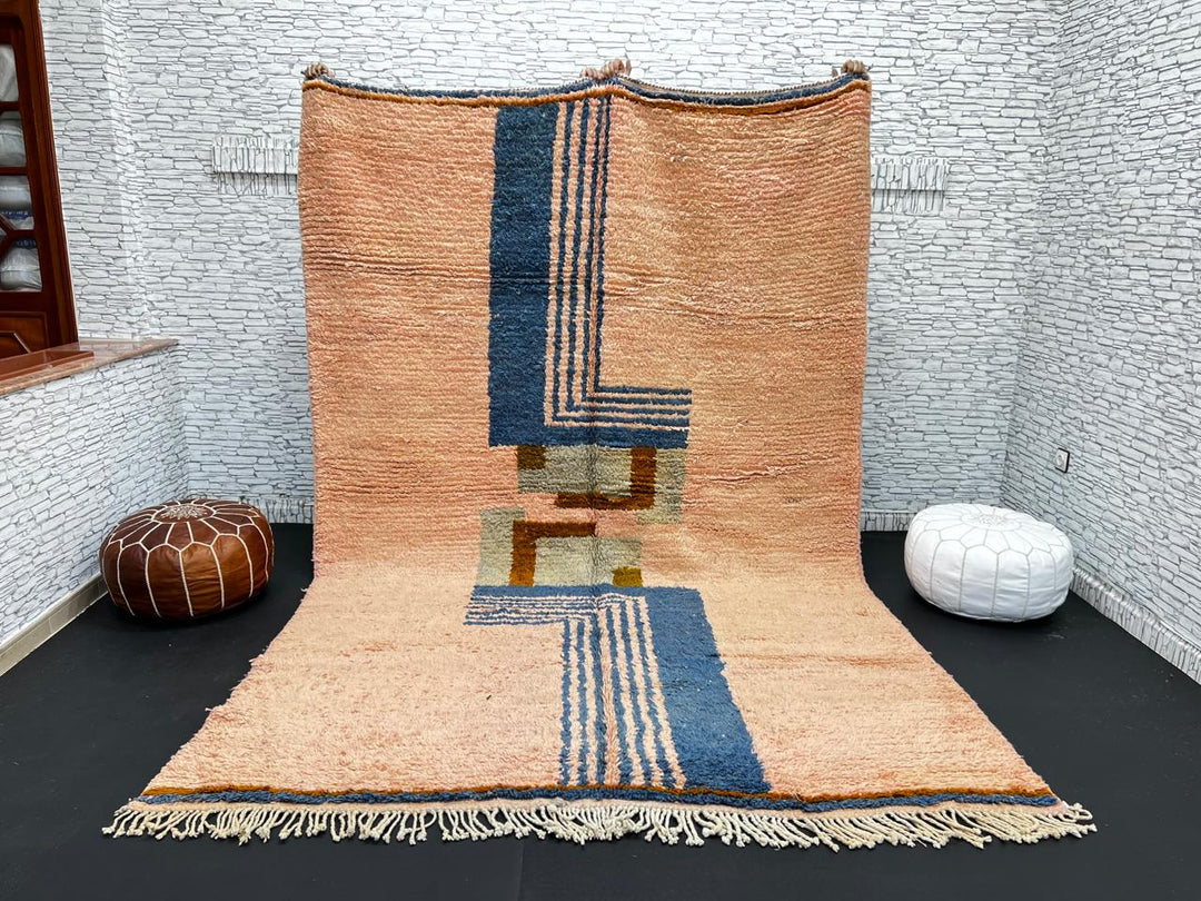 Terracotta Moroccan wool rug with blue and olive geometric shapes, handmade by Berber artisans
