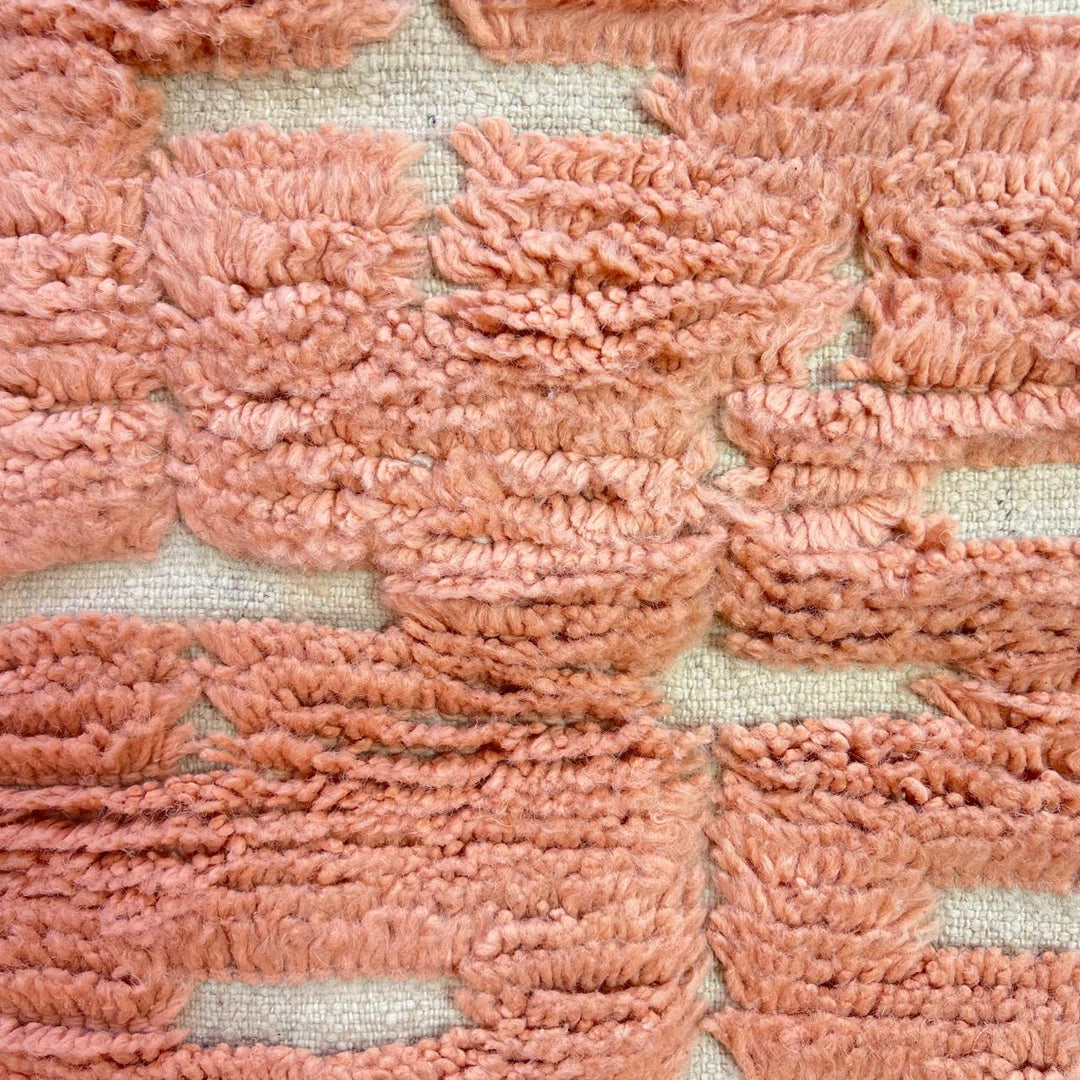 Textured peach Moroccan wool runner rug with raised Berber geometric blocks