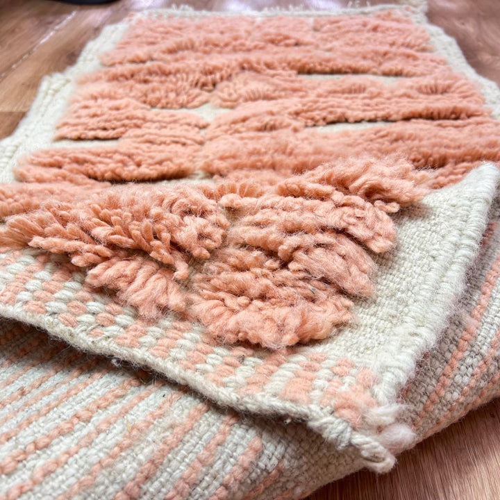 Textured peach Moroccan wool runner rug with raised Berber geometric blocks