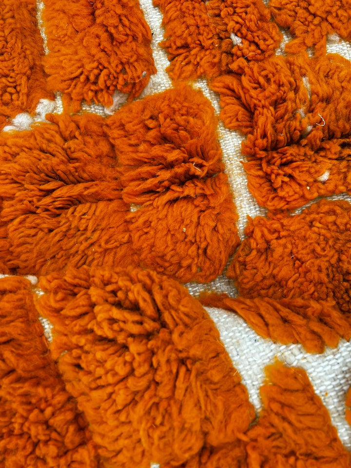 Handmade orange Moroccan runner rug with textured geometric pattern in natural wool, ideal for hallway and modern boho interiors.