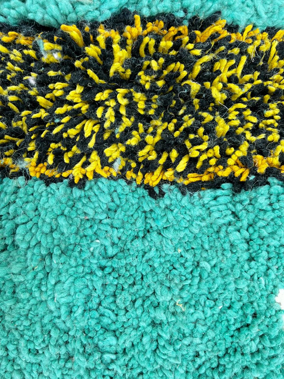 Handmade turquoise Moroccan wool runner rug with abstract geometric pattern and multicolor artistic details.