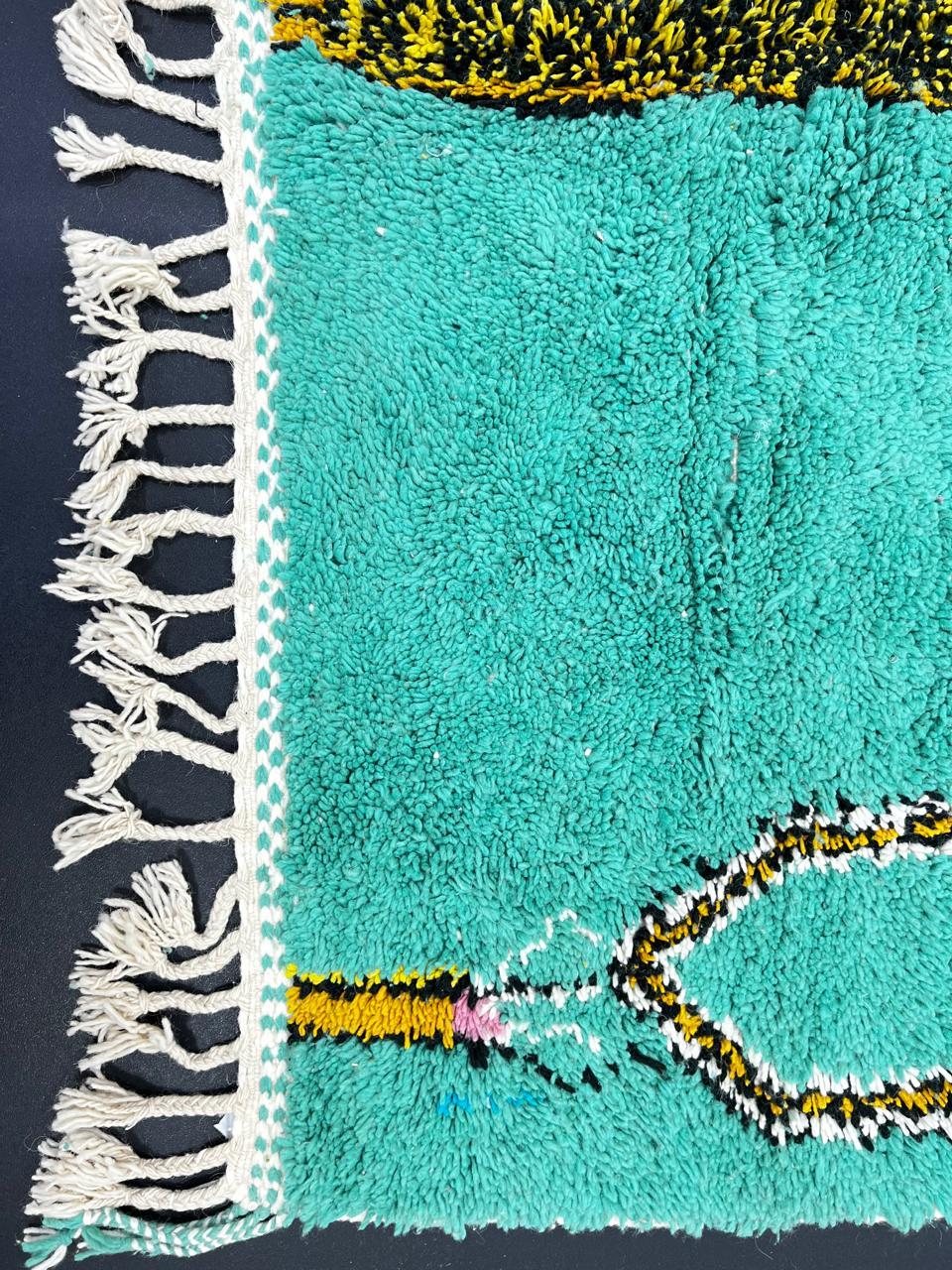 Handmade turquoise Moroccan wool runner rug with abstract geometric pattern and multicolor artistic details.