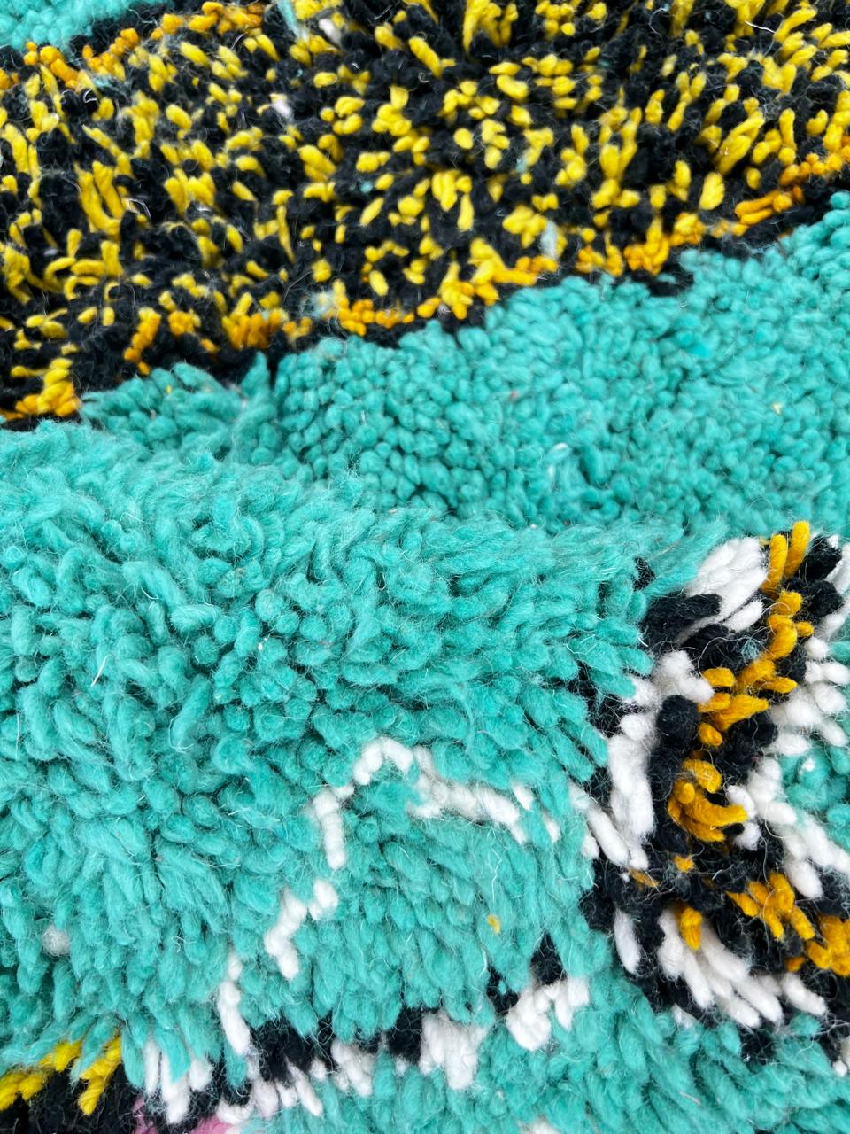 Handmade turquoise Moroccan wool runner rug with abstract geometric pattern and multicolor artistic details.